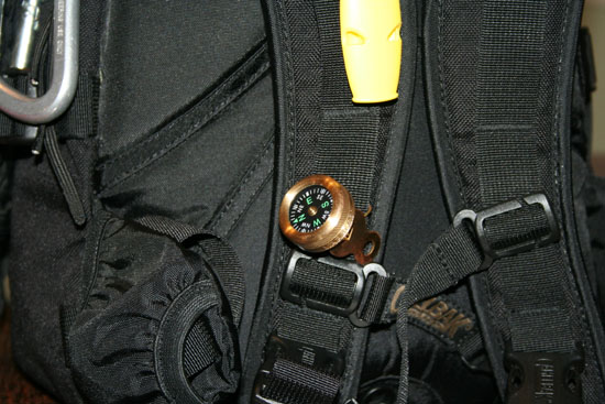 Closer detail of Rescue Howler whistle and Marble's Compass